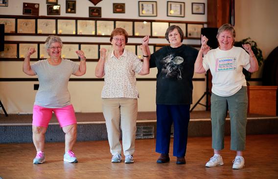 Edwina exercising with other seniors