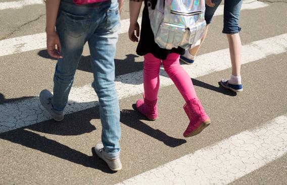 Children walking across a crosswalk