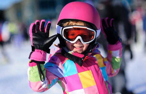 Girl in pink ski helmet