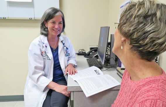 Susan Distasio speaking with a patient.