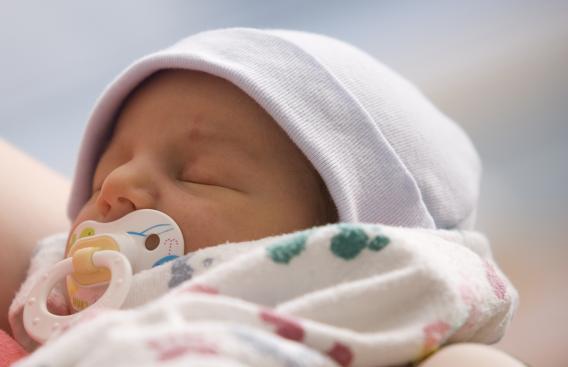 infant in mother's arms