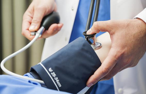 doctor using a blood pressure cuff