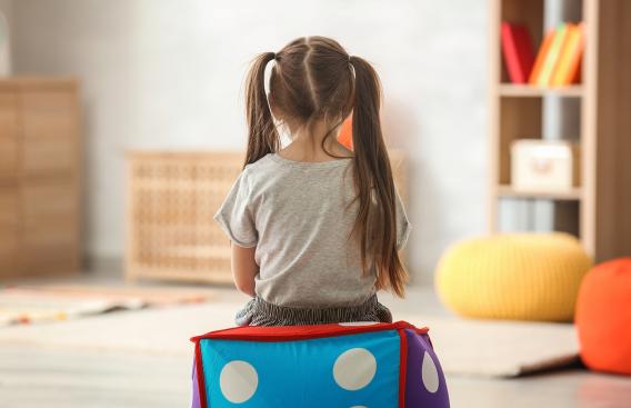 girl sitting a ball