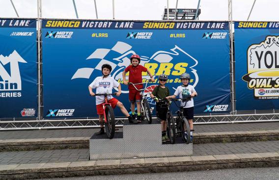 children on podium during safe kids event