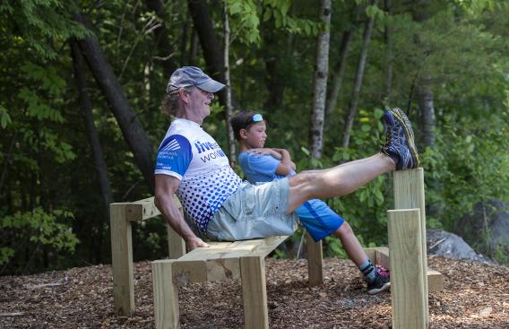 Bob McLellan and young boy on the Fit-Trail