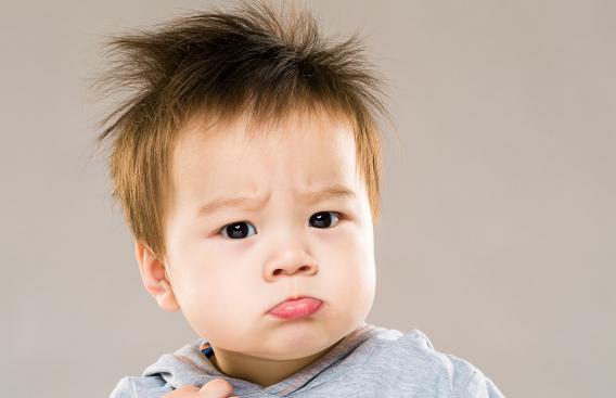 Pouting asian toddler
