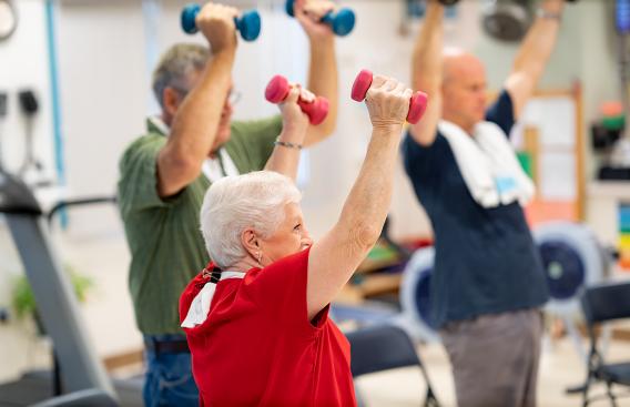 Cardiac Rehab participants lifting weights