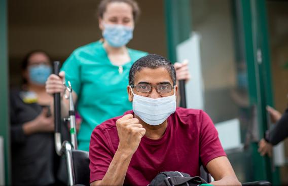 Elizeu being wheeled out of Dartmouth-Hitchcock Medical Center