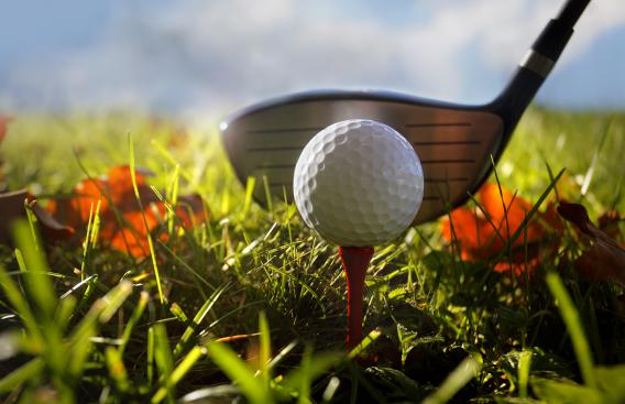 golf club, golf tee and golf ball on fall background