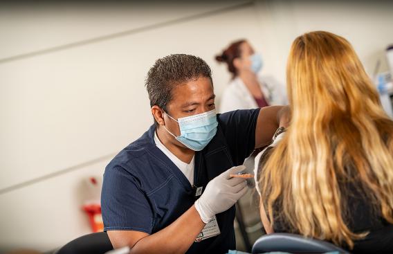 Nurse giving a flu vaccination