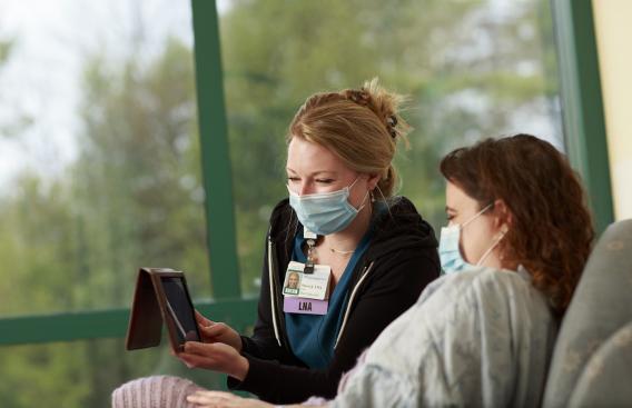 Sierra Jangel, LNA, helps a patient with a virtual visit