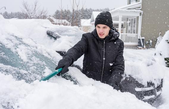 Young teen cleaning off his vehicle