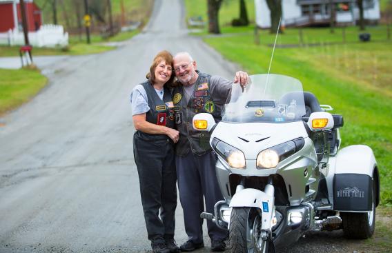 Harry Swett with his wife and motorcycle