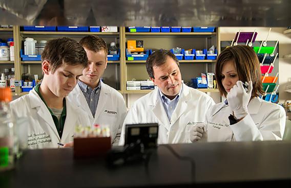 Researchers performing genetic sequencing