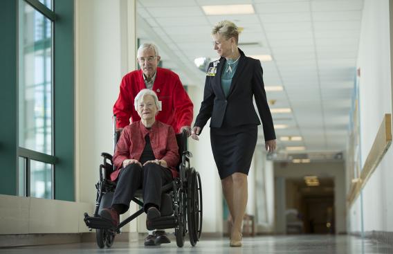 A volunteer helps a patient