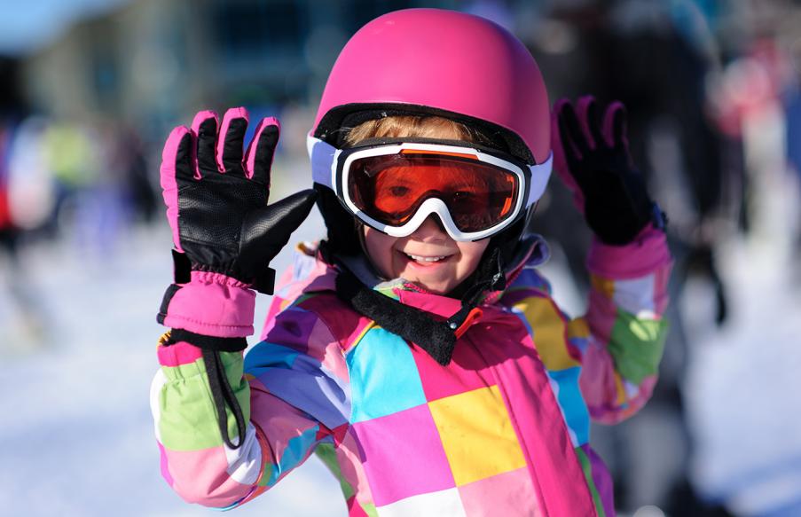 Girl in pink ski helmet